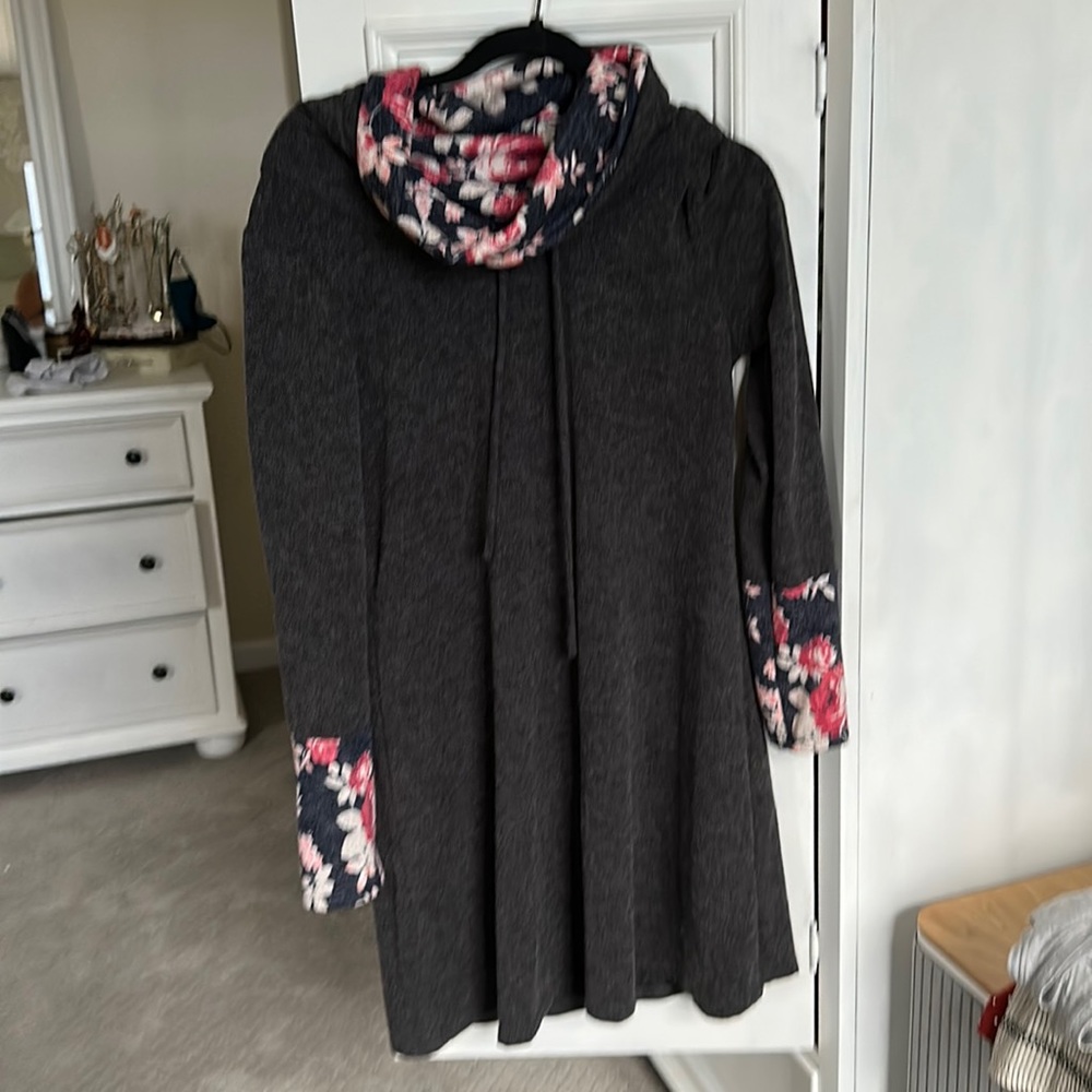 Gray sweater dress with navy floral funnel neck.